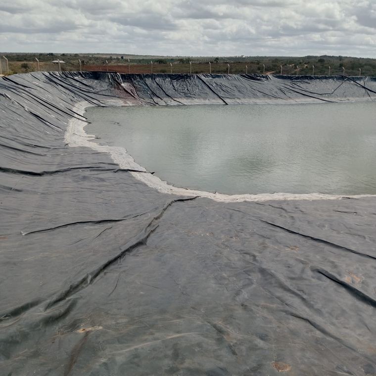 Liner installed across a farm water pan